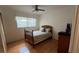 Cozy bedroom with hardwood floors and a comfortable bed. Features a sunny window and closet at 1329 Se 36Th Ave, Ocala, FL 34471