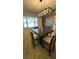 Dining room featuring an elegant light fixture and four chairs at 1329 Se 36Th Ave, Ocala, FL 34471