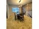 Dining room with hardwood floors and a decorative wallpaper at 1329 Se 36Th Ave, Ocala, FL 34471
