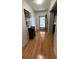 Inviting entryway with hardwood floors, decorative cabinet, and a view of the front door at 1329 Se 36Th Ave, Ocala, FL 34471