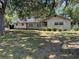 Beautiful single-story home with well-maintained lawn and lush landscaping at 1329 Se 36Th Ave, Ocala, FL 34471