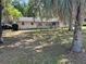 Well-kept one-story home with a large front yard shaded by mature trees at 1329 Se 36Th Ave, Ocala, FL 34471