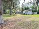 Charming single-story home with a spacious front yard and mature trees draped with Spanish moss at 1329 Se 36Th Ave, Ocala, FL 34471