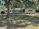 Charming single-story home with a well-maintained lawn and mature trees at 1329 Se 36Th Ave, Ocala, FL 34471