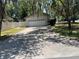 Spacious two-car garage with a concrete driveway and backyard access at 1329 Se 36Th Ave, Ocala, FL 34471