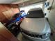 A packed two-car garage with two vehicles and equipment and household items at 1329 Se 36Th Ave, Ocala, FL 34471