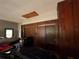 Garage with wood paneled walls, overhead storage, and two cars parked at 1329 Se 36Th Ave, Ocala, FL 34471
