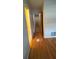 Hallway with hardwood flooring and views of rooms at 1329 Se 36Th Ave, Ocala, FL 34471