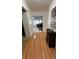 Hallway featuring hardwood floors and decor at 1329 Se 36Th Ave, Ocala, FL 34471