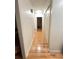Hallway boasts hardwood floors and closet with multiple doors at 1329 Se 36Th Ave, Ocala, FL 34471