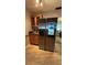 Modern kitchen showcasing a stainless steel refrigerator with built-in screen and adjacent cabinetry on top of the tiled flooring at 1329 Se 36Th Ave, Ocala, FL 34471
