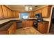 Spacious kitchen with wood cabinets, tile floors, stainless steel appliances and natural light at 1329 Se 36Th Ave, Ocala, FL 34471