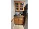 Kitchenette area with wood cabinets, granite countertop and compact design suitable for small kitchens at 1329 Se 36Th Ave, Ocala, FL 34471