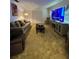 Cozy living area with large television, couch and open to the dining room at 1329 Se 36Th Ave, Ocala, FL 34471