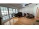 A spacious living room with hardwood floors, French doors, and a variety of furnishings at 1329 Se 36Th Ave, Ocala, FL 34471