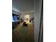 Living room featuring a couch, television, table and access to the dining room at 1329 Se 36Th Ave, Ocala, FL 34471