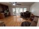 Bright, open-plan living room featuring wood floors and natural light at 1329 Se 36Th Ave, Ocala, FL 34471