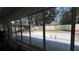 View of the in-ground pool and patio from the enclosed lanai at 1329 Se 36Th Ave, Ocala, FL 34471