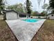 Backyard features an in-ground pool, patio, and plenty of space for entertaining at 1329 Se 36Th Ave, Ocala, FL 34471