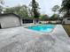 Backyard featuring a beautiful pool with outdoor covered structure at 1329 Se 36Th Ave, Ocala, FL 34471