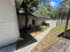 Exterior shot of the side yard featuring white fencing, walkway and convenient access to home's exterior at 1329 Se 36Th Ave, Ocala, FL 34471