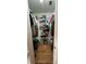 Walk-in closet with metal shelving for organized storage and hardwood floors at 1329 Se 36Th Ave, Ocala, FL 34471