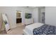 Cozy bedroom features a TV, neutral decor, and an ensuite bathroom for added convenience at 13748 Werrington Dr, Winter Garden, FL 34787