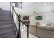 View of stairs leading up from the foyer to the kitchen and living room at 13748 Werrington Dr, Winter Garden, FL 34787