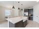 Bright kitchen with white countertops, gray cabinets, and a large island at 13748 Werrington Dr, Winter Garden, FL 34787