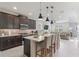 Open concept kitchen featuring a large island with bar seating and modern appliances at 13748 Werrington Dr, Winter Garden, FL 34787