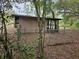 Fully fenced backyard with a view of the home's exterior, offering privacy and space for outdoor activities at 1424 Lake Shore Dr, Casselberry, FL 32707