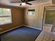 Bedroom with carpet flooring, windows providing natural light, and neutral-toned walls, creating a serene retreat at 1424 Lake Shore Dr, Casselberry, FL 32707