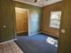 Bedroom with carpet flooring and windows providing natural light at 1424 Lake Shore Dr, Casselberry, FL 32707