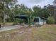 Charming single-story home featuring a covered carport and desert landscaping at 1424 Lake Shore Dr, Casselberry, FL 32707
