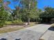 Home with a large front yard and driveway, providing ample parking and outdoor space at 1424 Lake Shore Dr, Casselberry, FL 32707