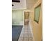 Hallway with tile flooring leading to living area at 1424 Lake Shore Dr, Casselberry, FL 32707