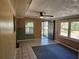 Living room features a ceiling fan and tile flooring at 1424 Lake Shore Dr, Casselberry, FL 32707
