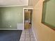 Hallway with neutral-colored walls and tile flooring at 1424 Lake Shore Dr, Casselberry, FL 32707