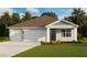 Charming single-story home with a three-car garage, neat landscaping, and a welcoming entrance at 1487 Fountain View St, Ormond Beach, FL 32174