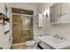 Updated bathroom with enclosed tile shower, toilet and vanity with storage at 1742 Barcelona Way, Winter Park, FL 32789