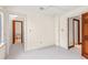 Bedroom showing two doorways and closet space and neutral carpet at 1742 Barcelona Way, Winter Park, FL 32789