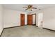 Spacious bedroom with carpet floor, featuring doors to a bathroom and closet at 1742 Barcelona Way, Winter Park, FL 32789