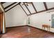 Bright bedroom featuring hardwood floors, beamed ceilings, and large windows at 1742 Barcelona Way, Winter Park, FL 32789