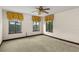 Cozy carpeted bedroom with windows and trim, creating a warm atmosphere at 1742 Barcelona Way, Winter Park, FL 32789