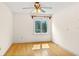 Bedroom featuring hardwood floors, neutral walls, and a ceiling fan at 1742 Barcelona Way, Winter Park, FL 32789