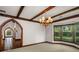 Charming dining room with beamed ceilings, bay window, and access to foyer at 1742 Barcelona Way, Winter Park, FL 32789