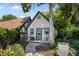 Charming exterior view of a cozy home featuring a lovely front yard, brick path, and inviting curb appeal at 1742 Barcelona Way, Winter Park, FL 32789