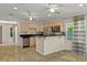 Bright kitchen with stainless steel appliances, a breakfast bar, and tile flooring at 1742 Barcelona Way, Winter Park, FL 32789