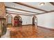Relaxing living room boasts tile flooring, wet bar, beamed ceilings, and stone fireplace at 1742 Barcelona Way, Winter Park, FL 32789
