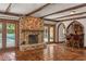 Open-concept living room featuring fireplace, pool view, tile flooring, and bar at 1742 Barcelona Way, Winter Park, FL 32789